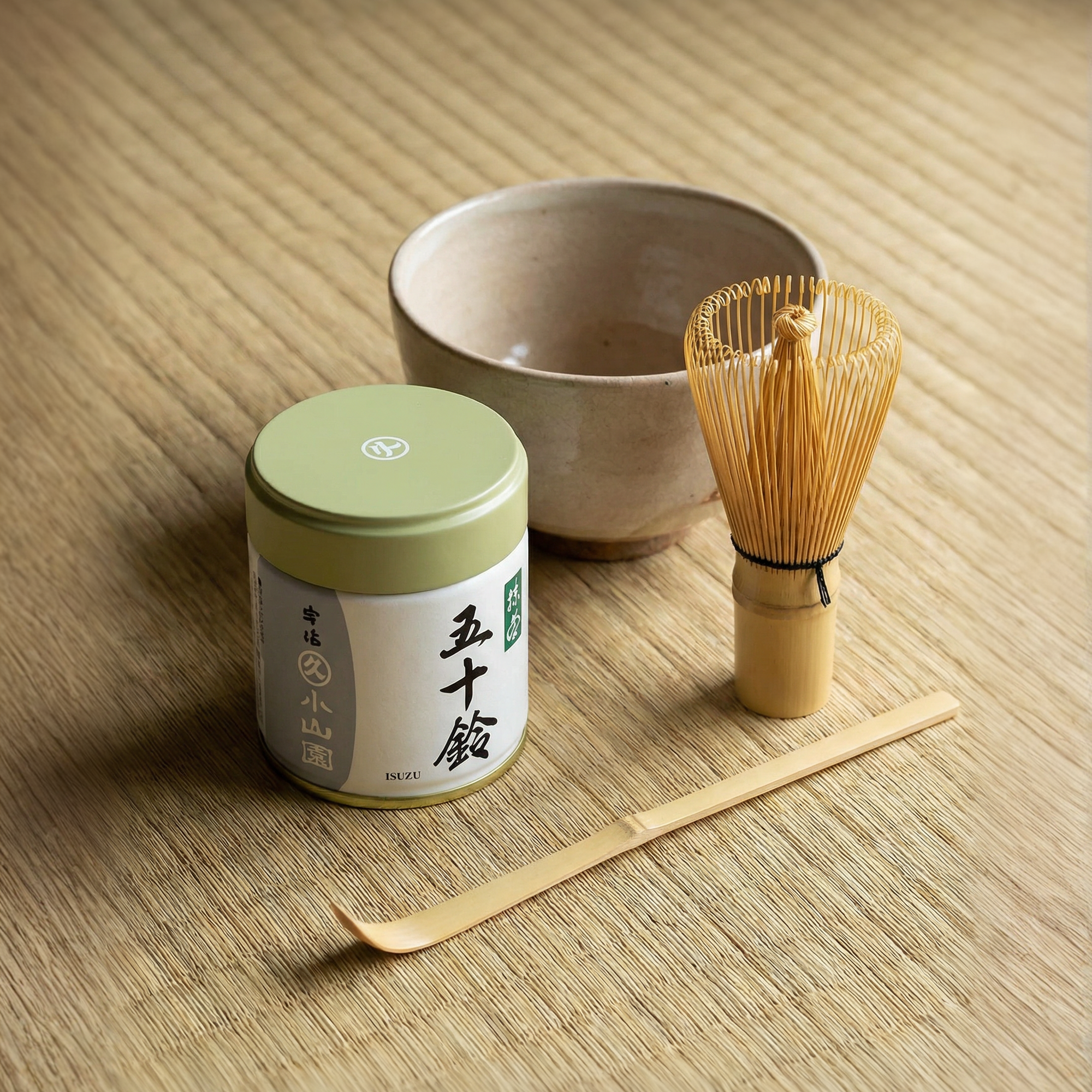 Marukyu Koyamaen Isuzu Japanese matcha powder in a 40 g metal tin with set of chawan, bamboo chasen & chashaku