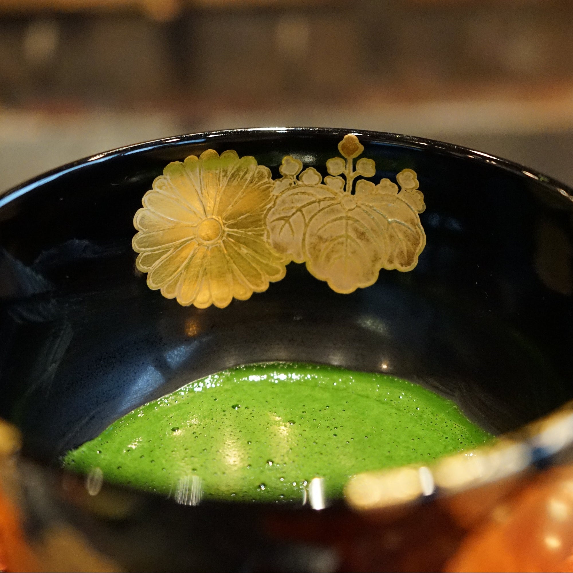 Uji Matcha Single Cultivar Asahi Koicha in a black super luxurious chawan with emperor motifs. 